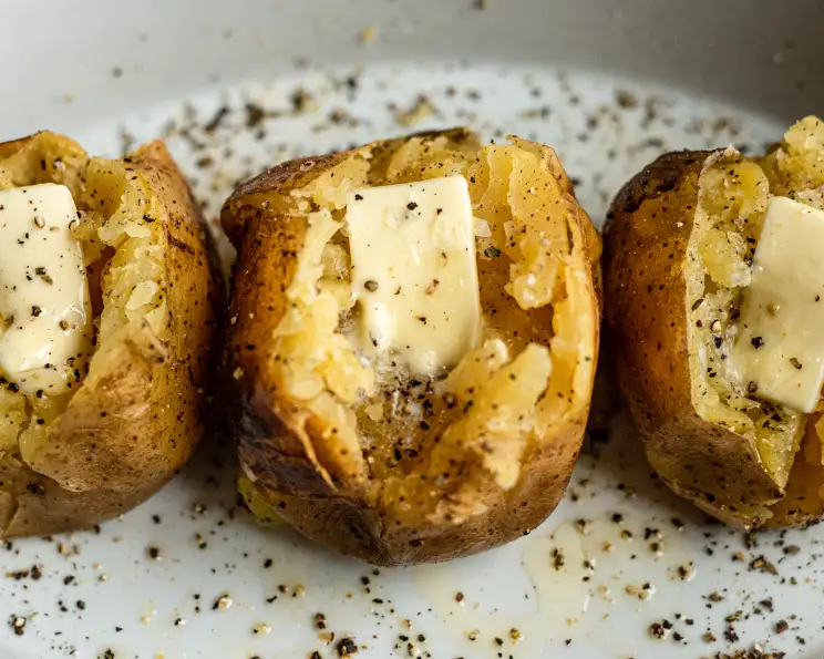 Slow Cooker Baked Potatoes served on plate